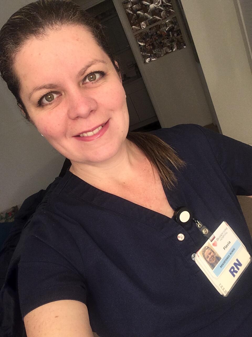 Selfie of woman in nurse's scrubs