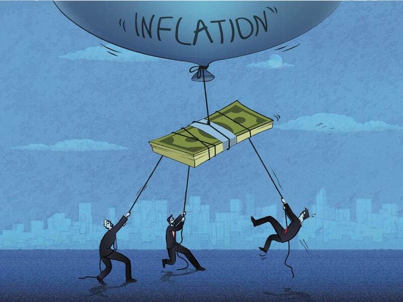 Three men in suits holding ropes tied to a stack of dollar bills being lifted into the hair by a balloon that says \"inflation.\"