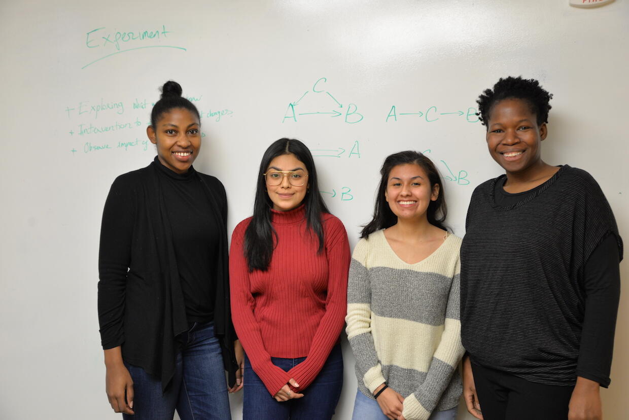 A team of students in the lab of Tiffany Green, Ph.D., an assistant professor in the Department of Health Behavior and Policy (right), is working on an app for low-income pregnant Latinx women. From right: Ashley Williams, a sociology master’s degree student; Maria Gonzalez, a junior biology major; and Jessy Lemus, a freshman international social justice major. Not pictured are VCU student team members Maryam Azeem and Muloongo Simuzingili. (Courtesy photo)