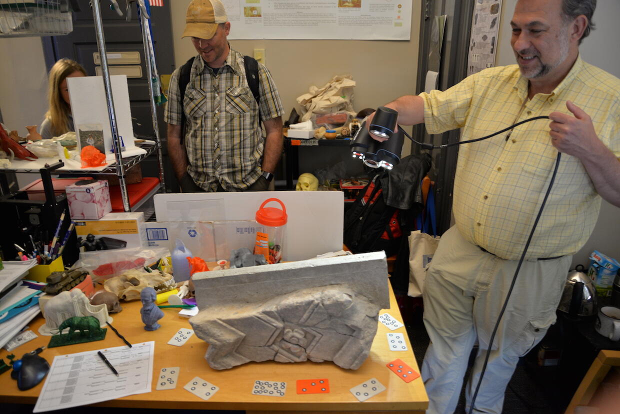 Bernard Means, Ph.D., director of VCU's Virtual Curation Laboratory, 3D scans a mantle fragment from the Fairfield manor house in Gloucester County.