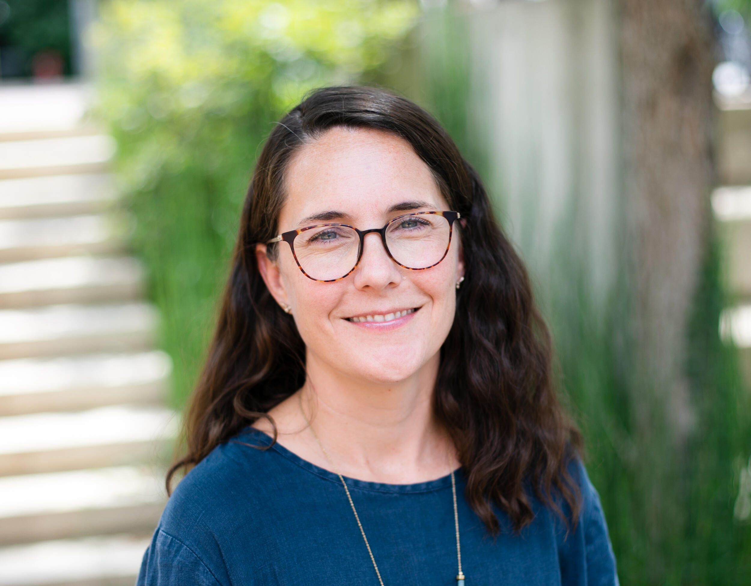 A photo of a woman from the shoulders up. 