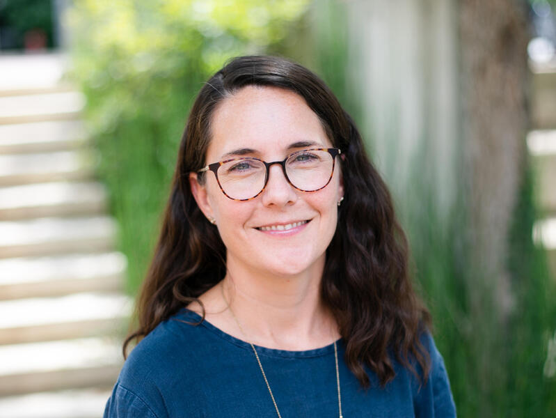 A photo of a woman from the shoulders up. 