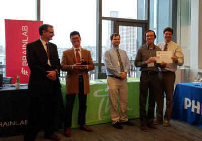Brian Leong (second from right) with Todd McNutt, 2015 president of the Mid-Atlantic Chapter of AAPM. 
