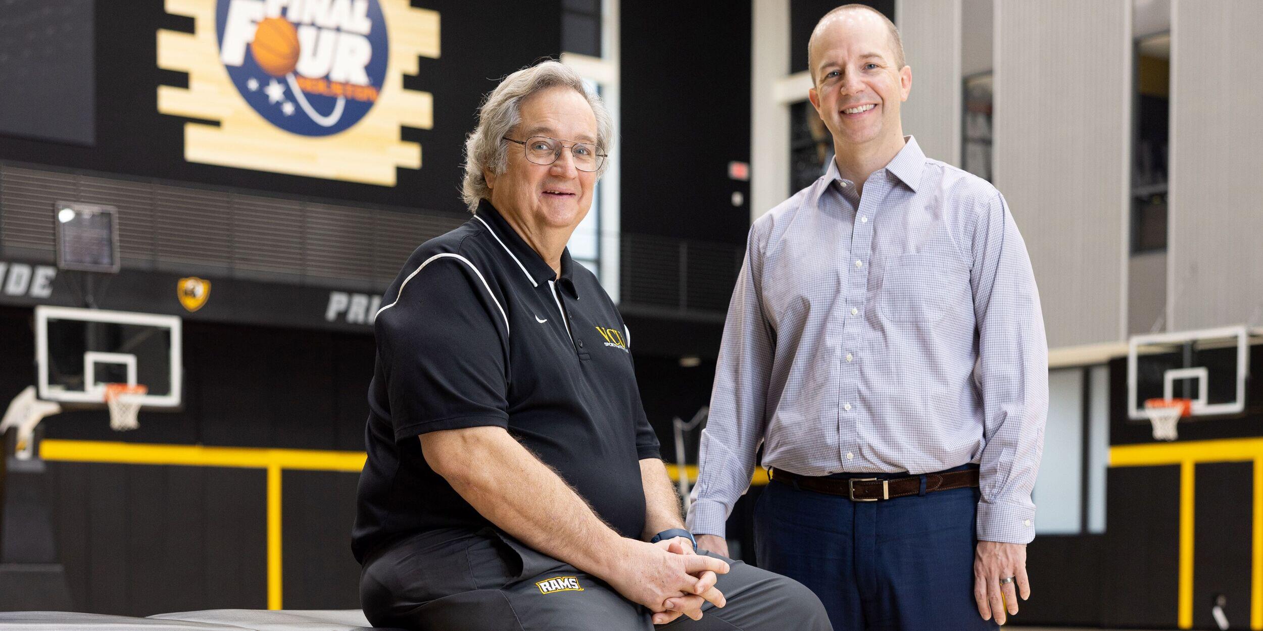 Two men on a basketball court. 