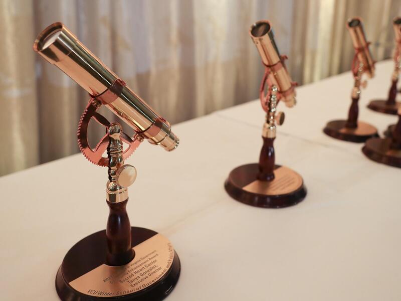 A photo of five awards that look like telescopes 