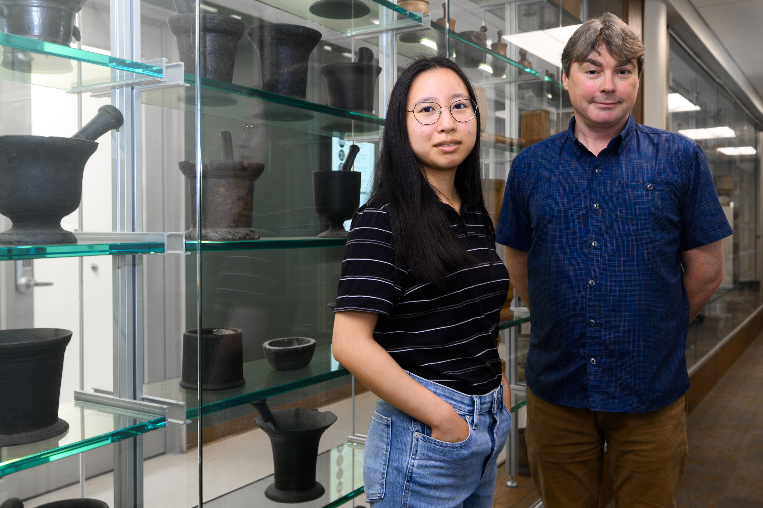 A photo of a man and woman standing next to each other from hips up. 