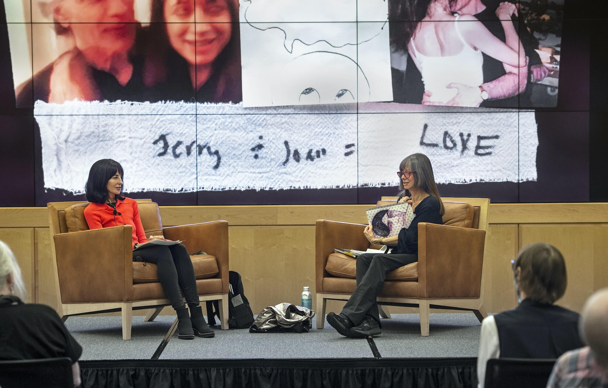 Sara Monroe, left, and Joan Gaustad, right, speak at an event.