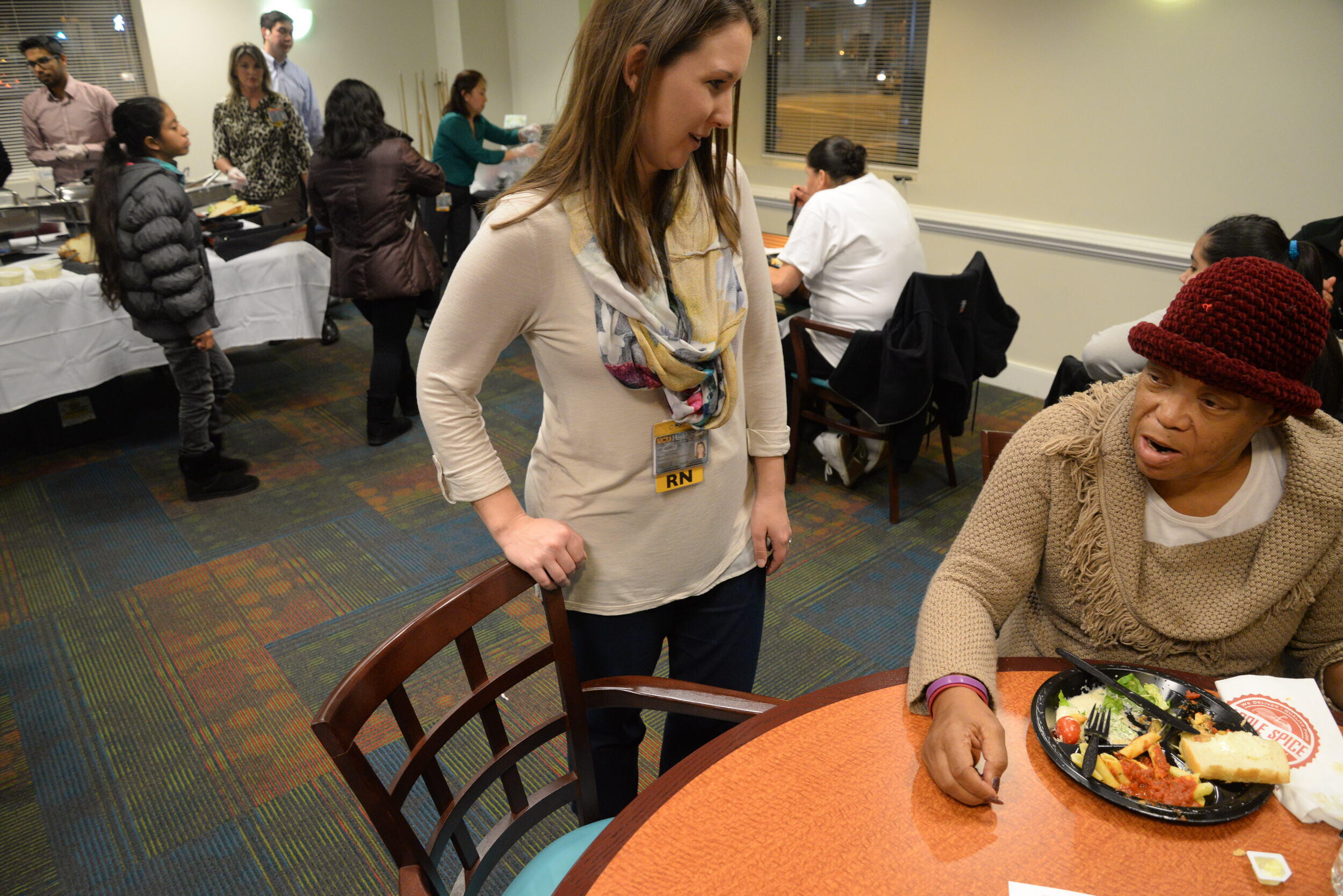 Mattie Dixon speaks to Caitlin Winkler, Hume-Lee’s transplant program manager.