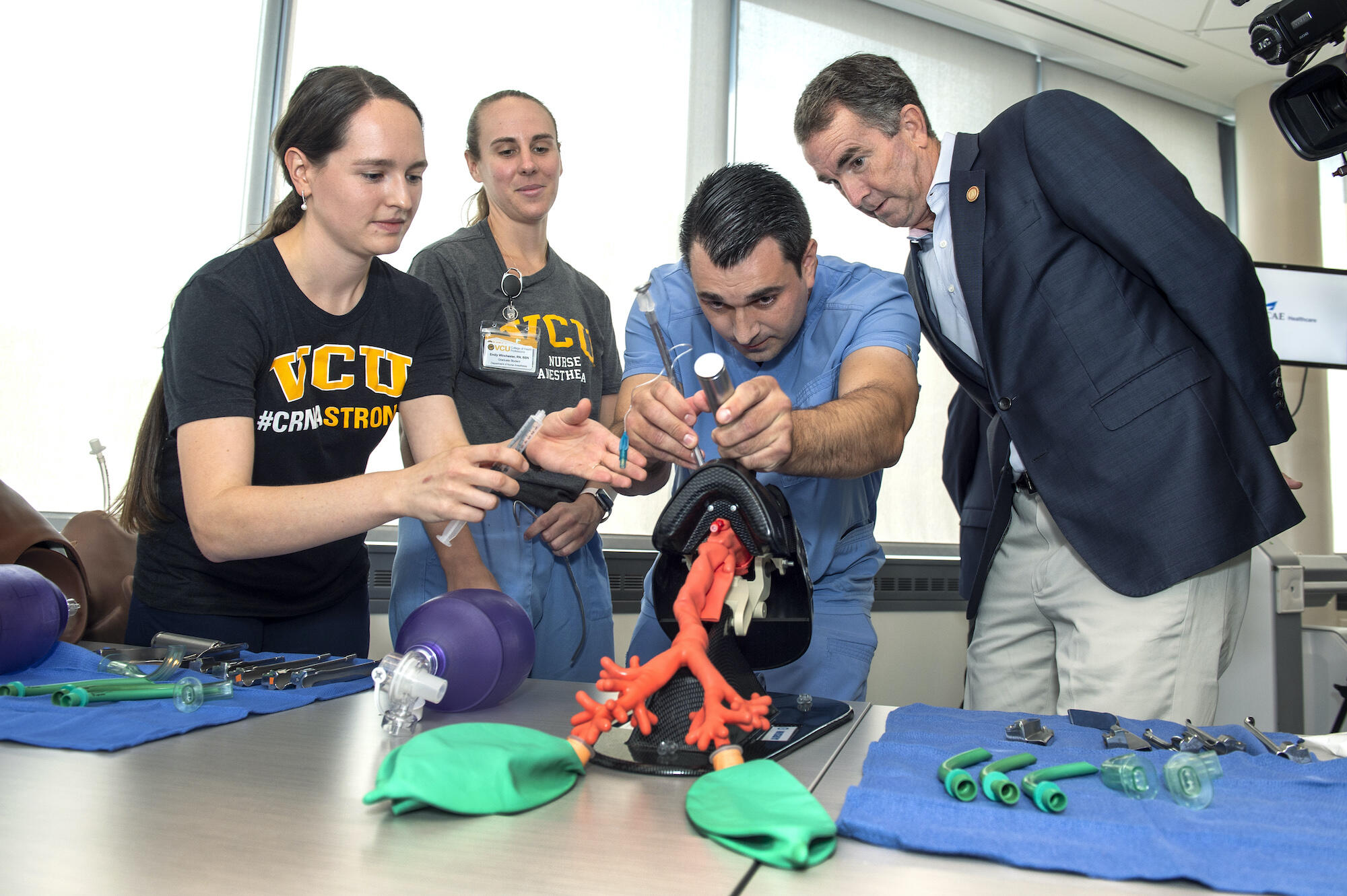 Gov. Ralph Northam, right, on his tour of the VCU College of Health Professions building