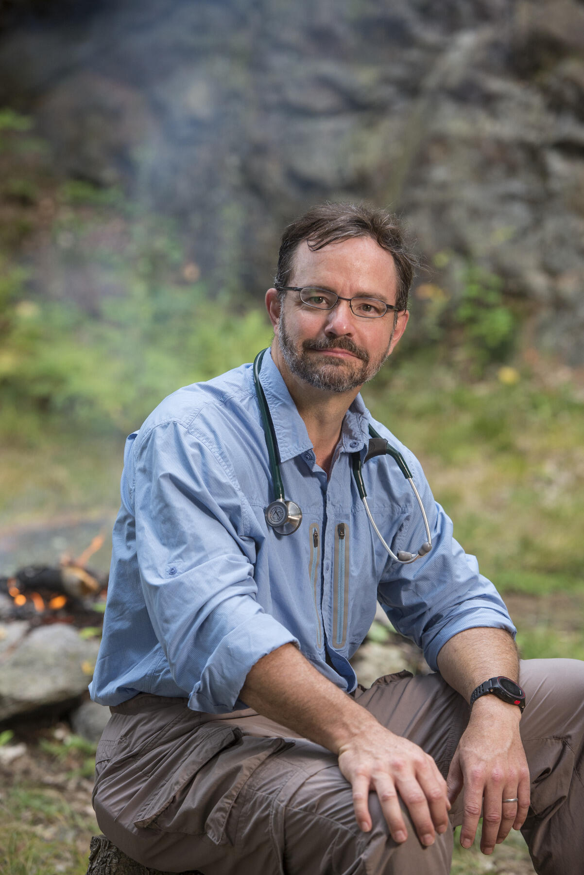 Man seated outdoors.