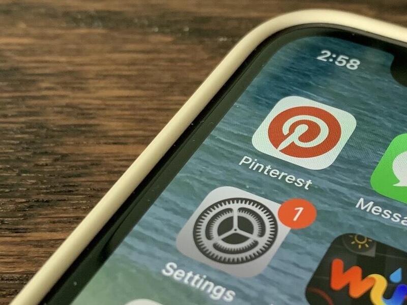 The screen of a smartphone showing icons for Pinterest and other applications.