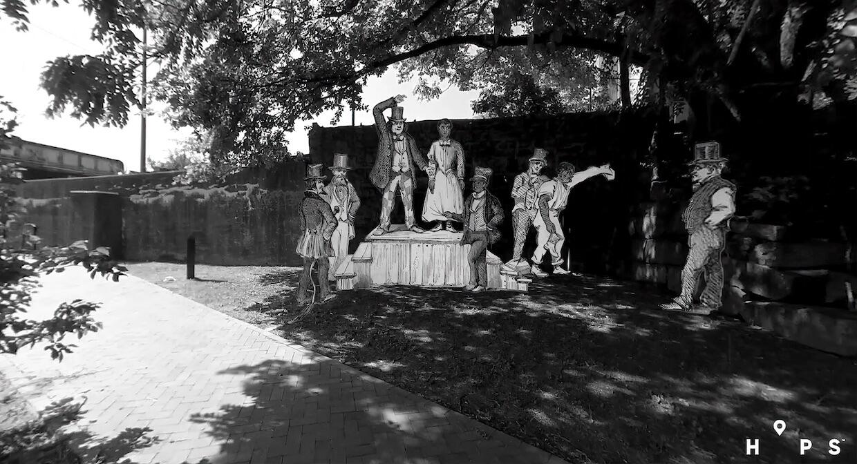street view of a piece of land in Richmond Virginia with a sketch of a slave auction block superimposed over it.