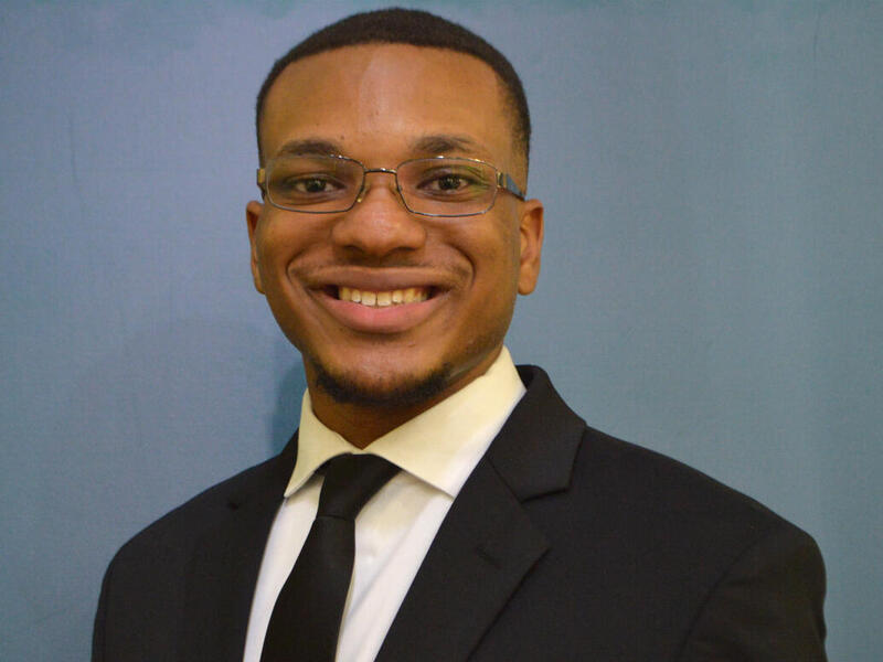 Smiling head shot photo of Austin Ezzard.