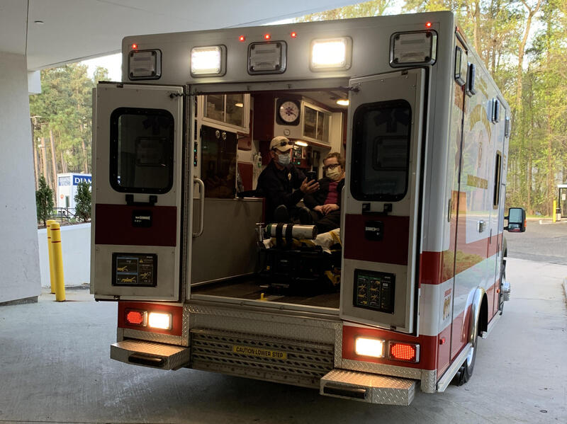 An ambulance with two people inside.
