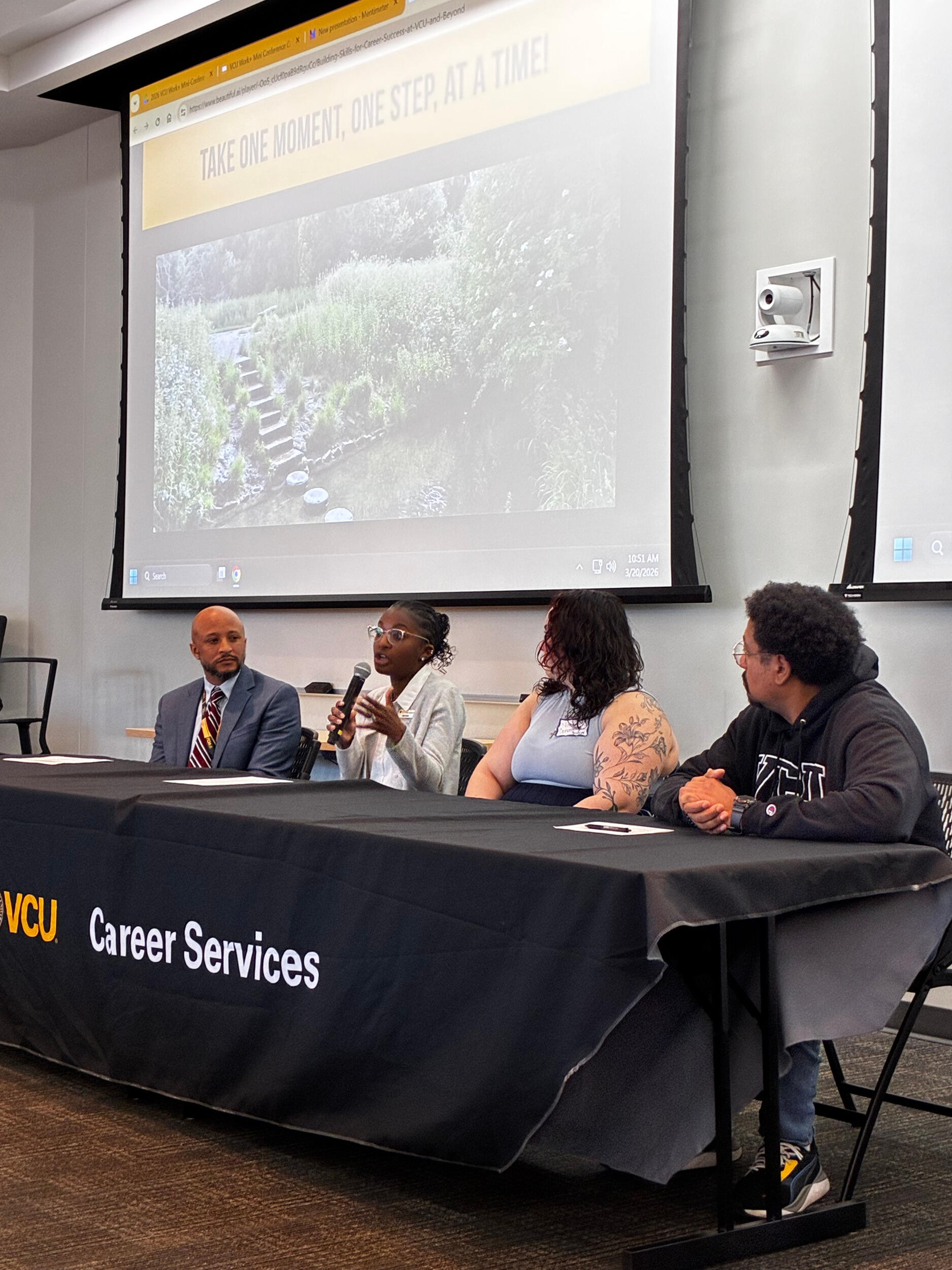 A photo of four people sitting at a table. 