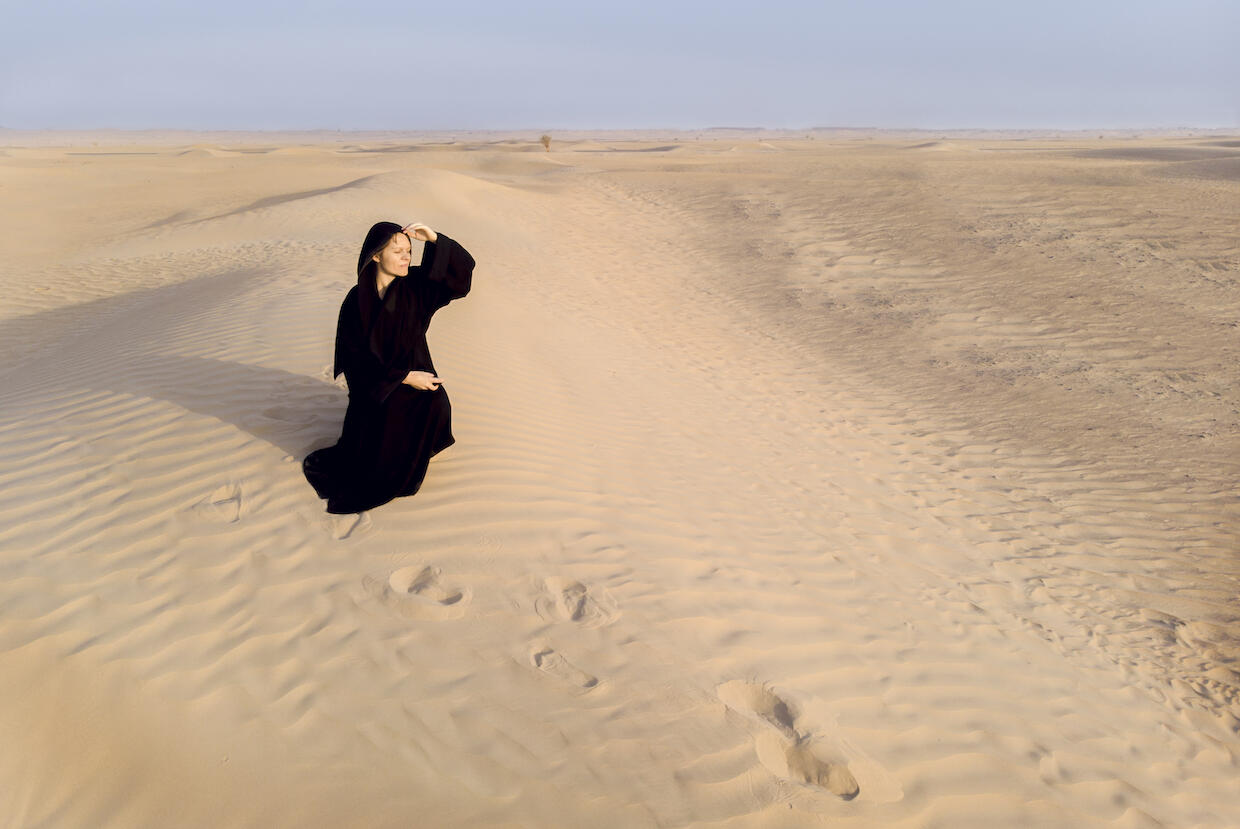 A woman in a traditional abaya.