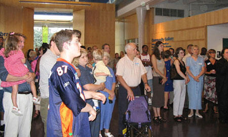 Important Patrons. Some of the 600 attendees look on during a brief ceremony for the VCU Medical Center's PICU, during the 4-hour celebration at the Children's Museum of Richmond.

Photos by Michael Ford, University News Services