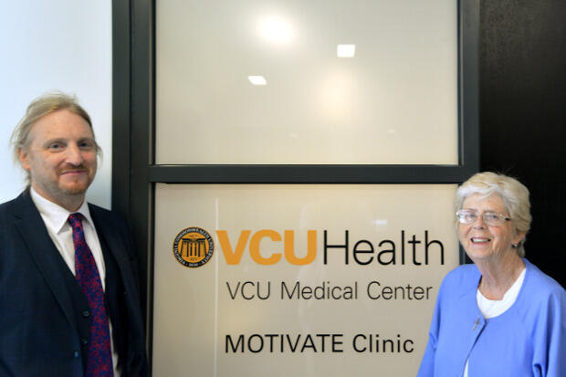 Mishka Terplan, M.D. and Cathy Wilson stand outside the doors of the MOTIVATE Clinic .