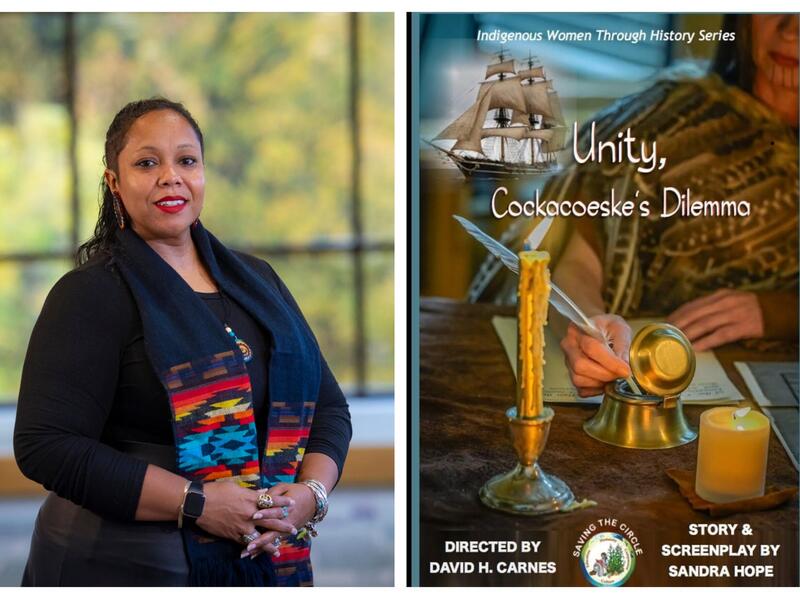 A photo of a woman from the waist up to the right of a movie poster. The movie poster shows a woman wearing traditional native american clothing sitting at a desk with a piece of paper in front of her. The woman is dipping a quill into an ink well. In front of the ink well is a candle in a candle stick, and a large flat candel. To the right of the woman is an illustration of an old ship. The poser says \"Indigenous Women Through History Series\" \"Unity, Coca Jake's Dilemma\" \"DIRECTED BY DAVID H. CANNES\" \"STORY & SCREENPLAY BY SANDRA HOPE\"