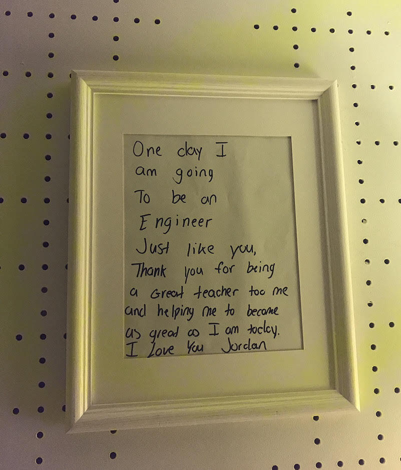 A letter framed on a wall.