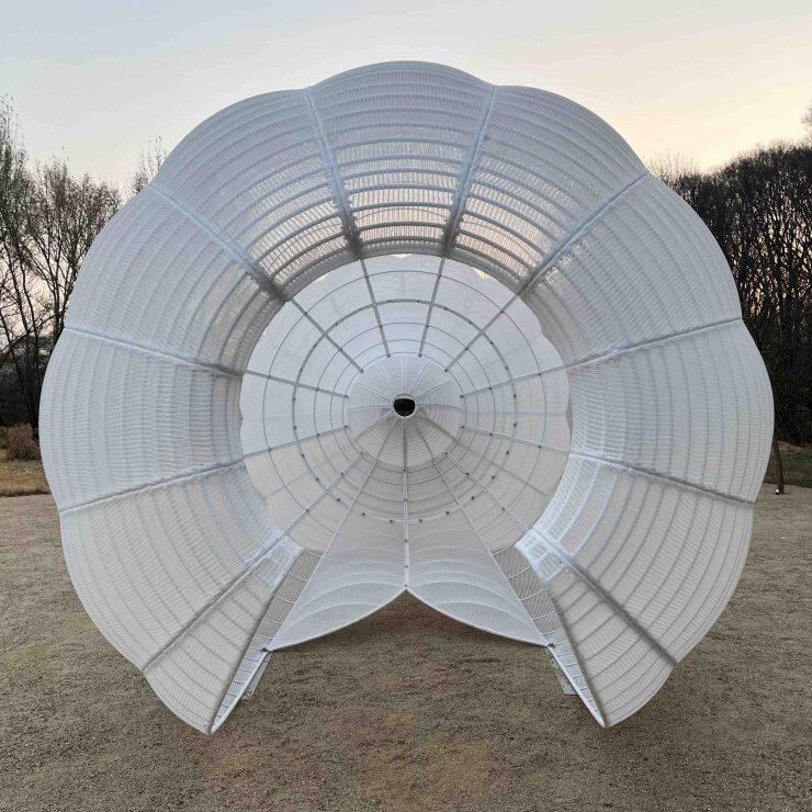 A view of the interior of a white sculptural structure.