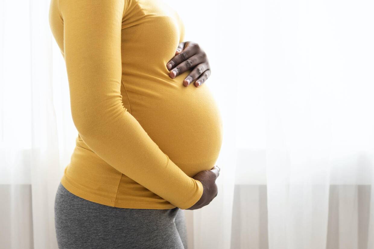 pregnant mother holding her belly