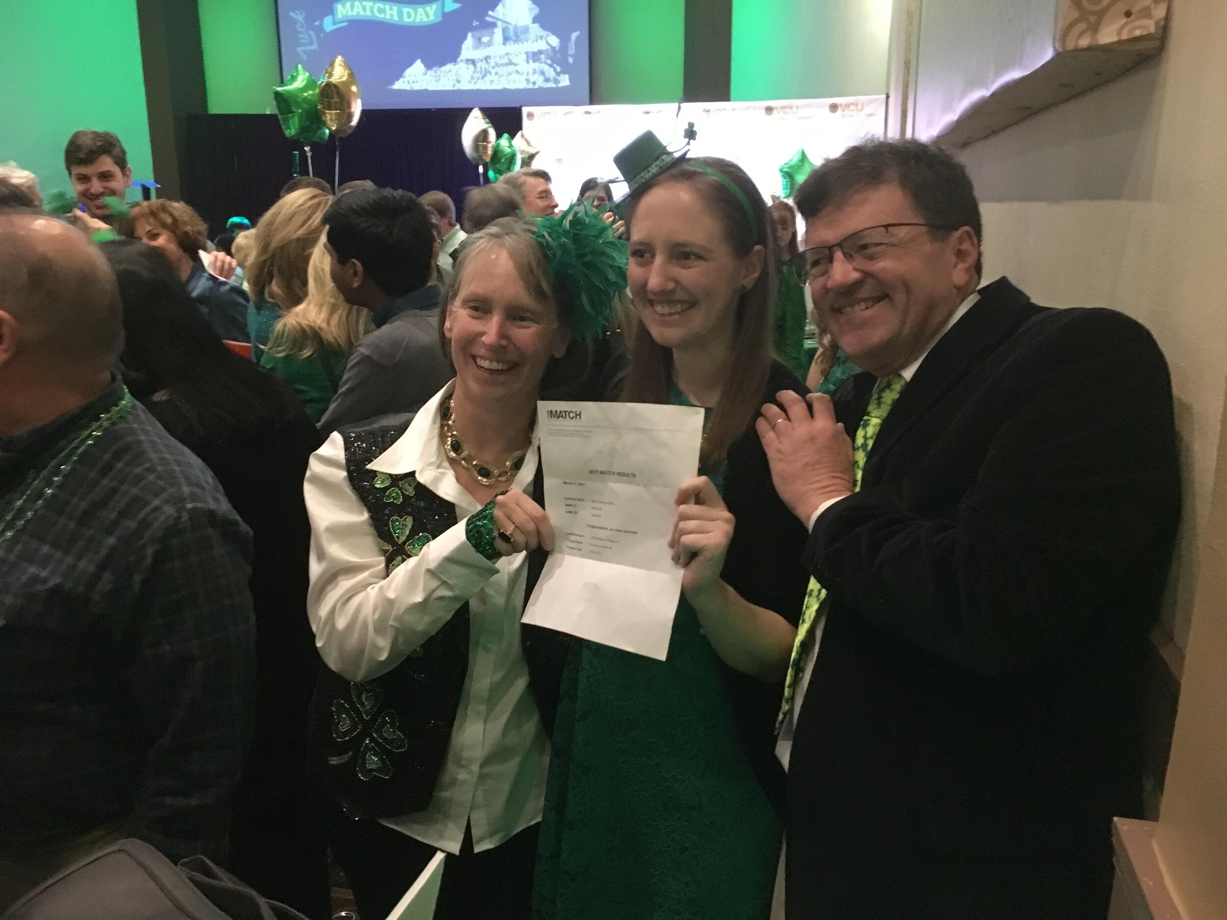 Kim Keith, M.D., and her husband, Isaac Keith, celebrate with their daughter Mary Kat Keith, M.D., at Mary Kat's Match Day.