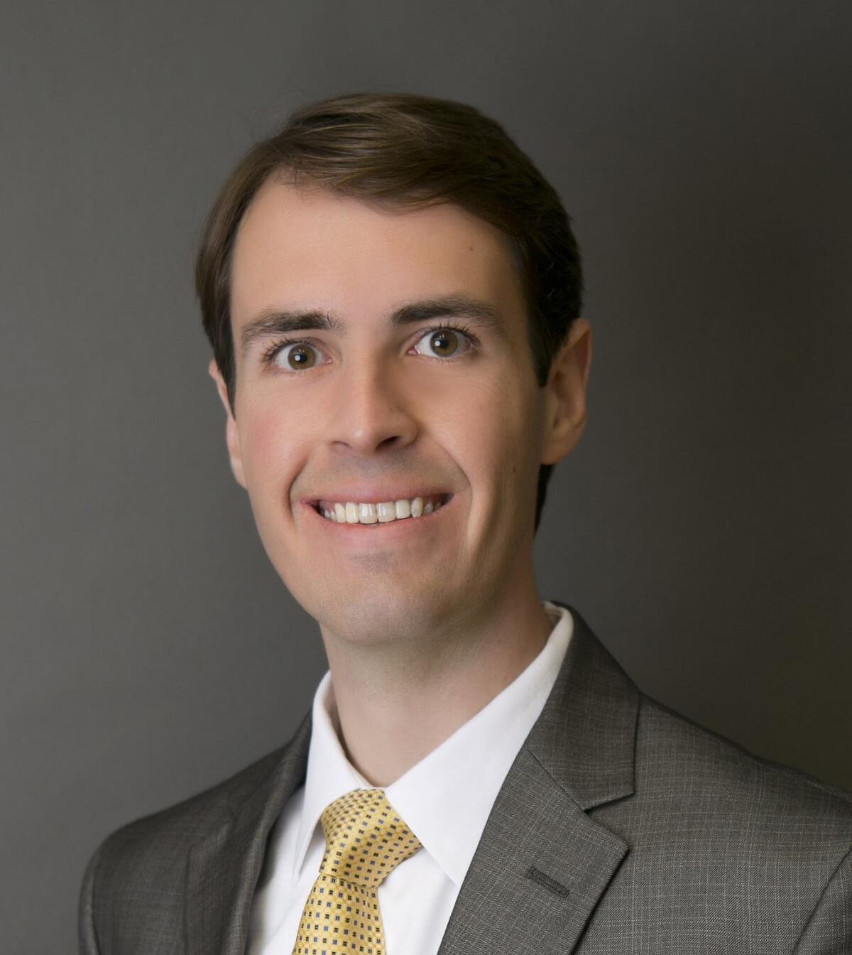 Christopher M. Herrington smiling at the camera