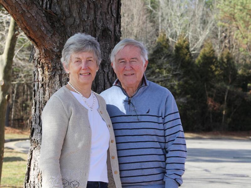 A photo of a man and woman with short gray hair standing next to each other. 