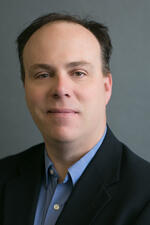 A photo of a man from the shoulders up