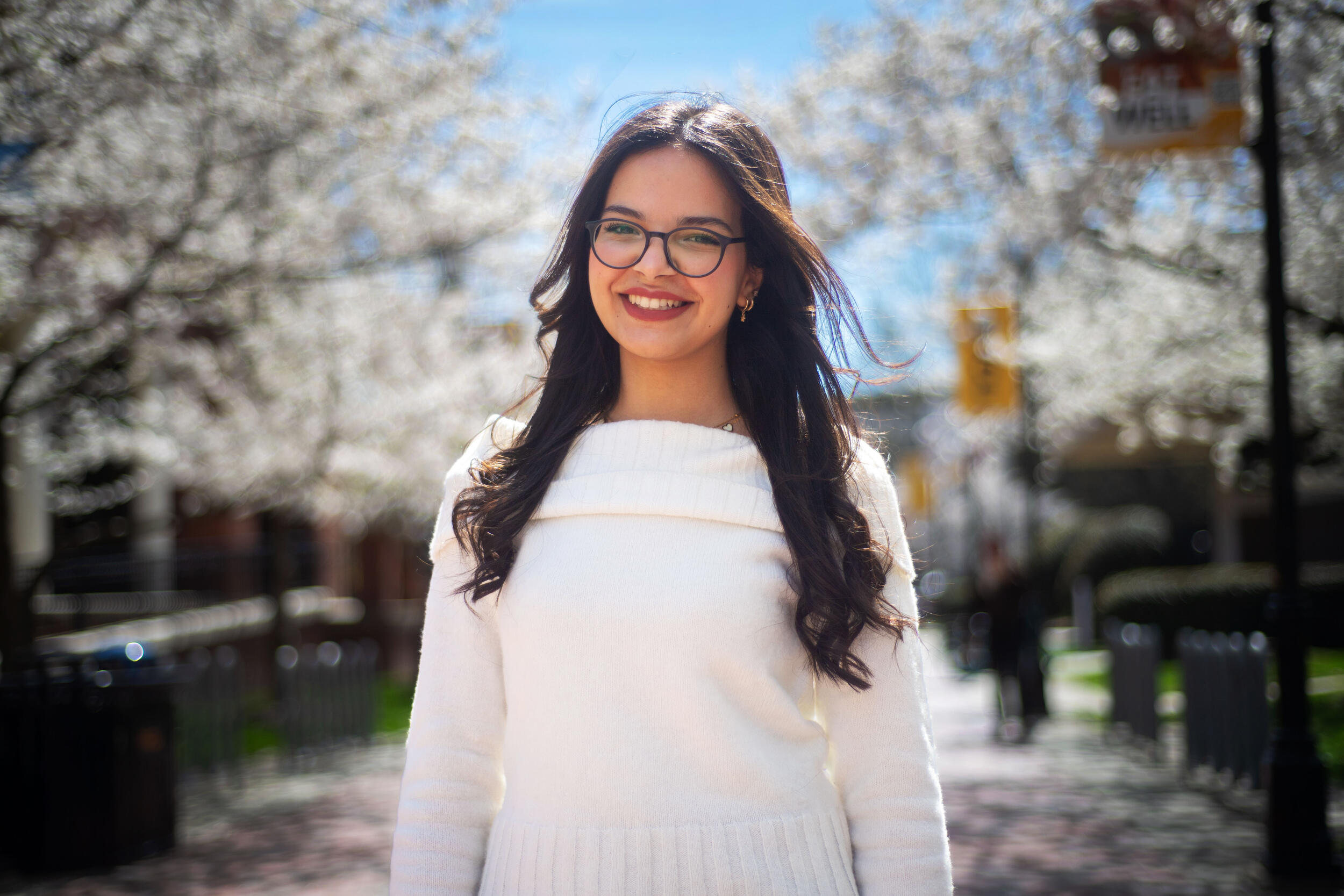 A photo of a woman from the waist up. 