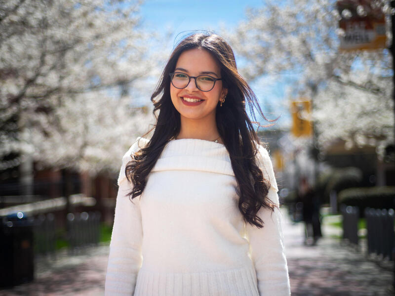 A photo of a woman from the waist up. 