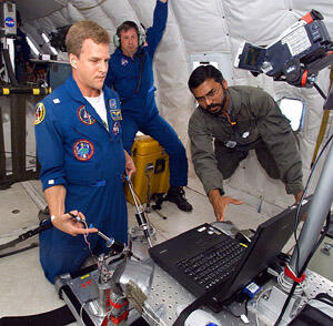 VCU's Azhar Rafiq, M.D., (right) and NASA's Noel Skinner observe astronaut Scott Parazynski performing computer -simulated surgical drills in microgravity during a previous flight aboard a NASA plane that simulates weightlessness.

Photo courtesy of NASA Research Partnership Center at VCU
