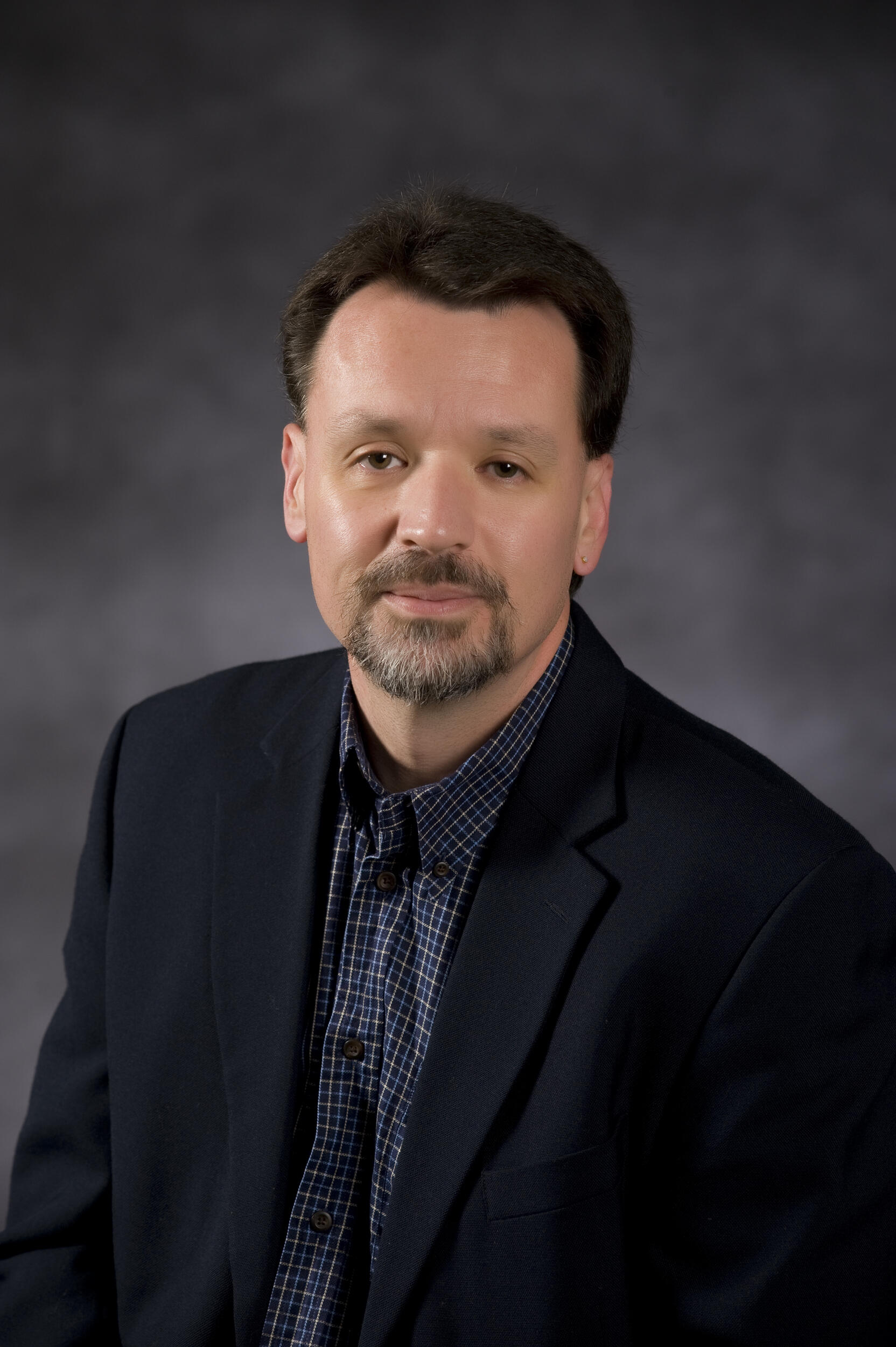 A portrait of John M. Aughenbaugh, Ph.D.