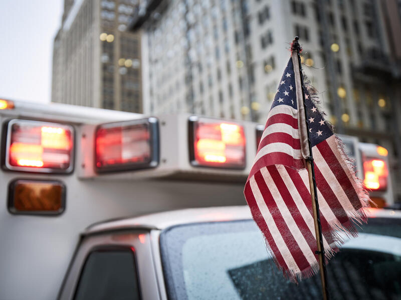 Photo of an American flag on an ambulance.
