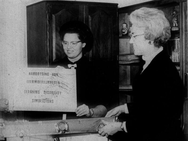 A black and white photo of two women 