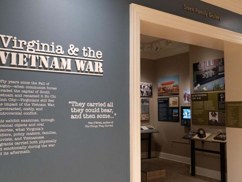 A photo of the entrance to a museum exhibit. Big white letters read \"Virginia & the VIETNAM WAR.\" 
