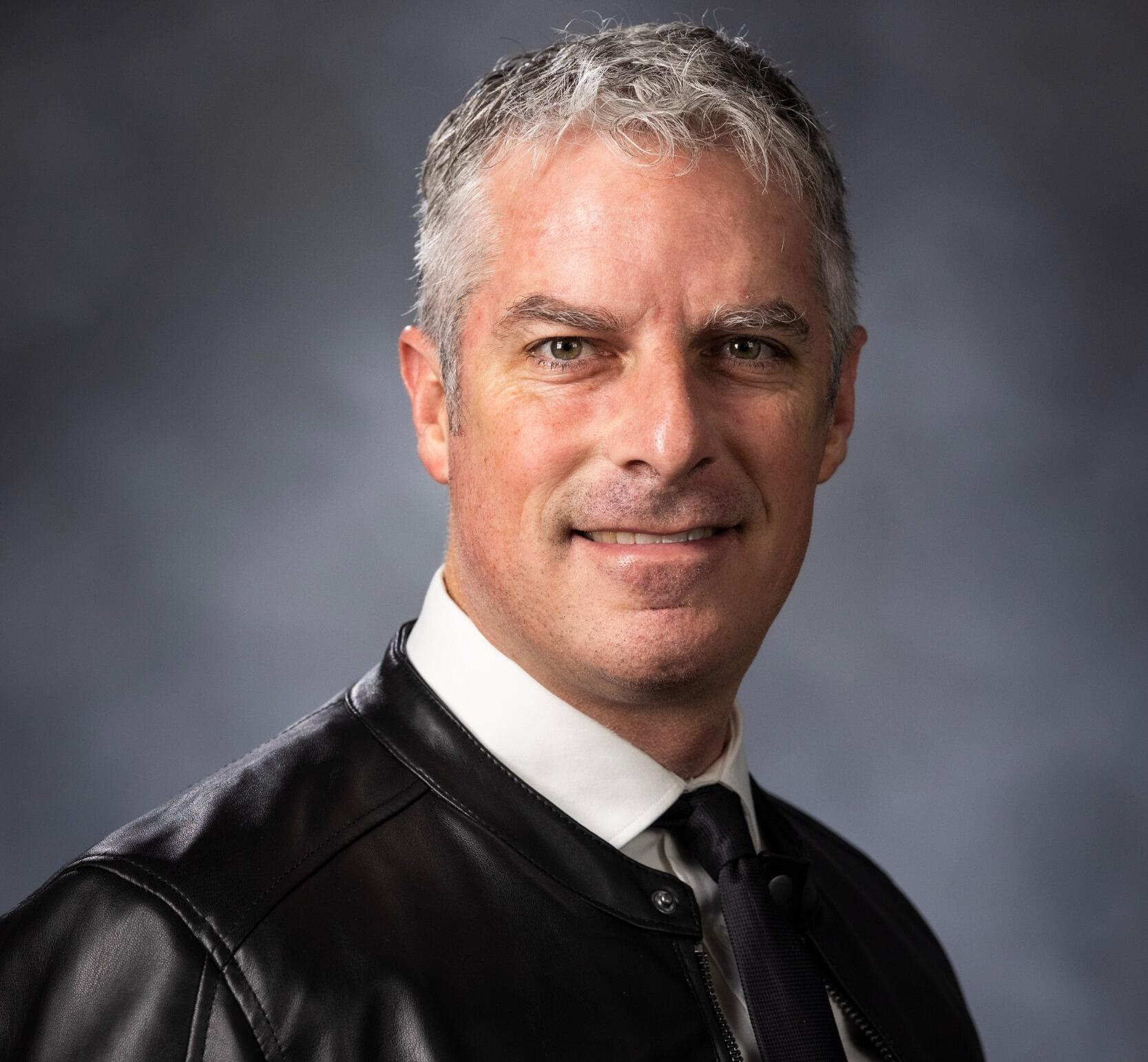 A photo of a man from the shoulders up