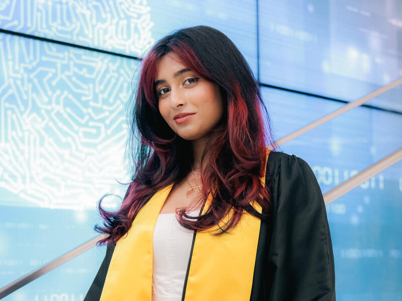 A photo of a woman from the shoulders up. 