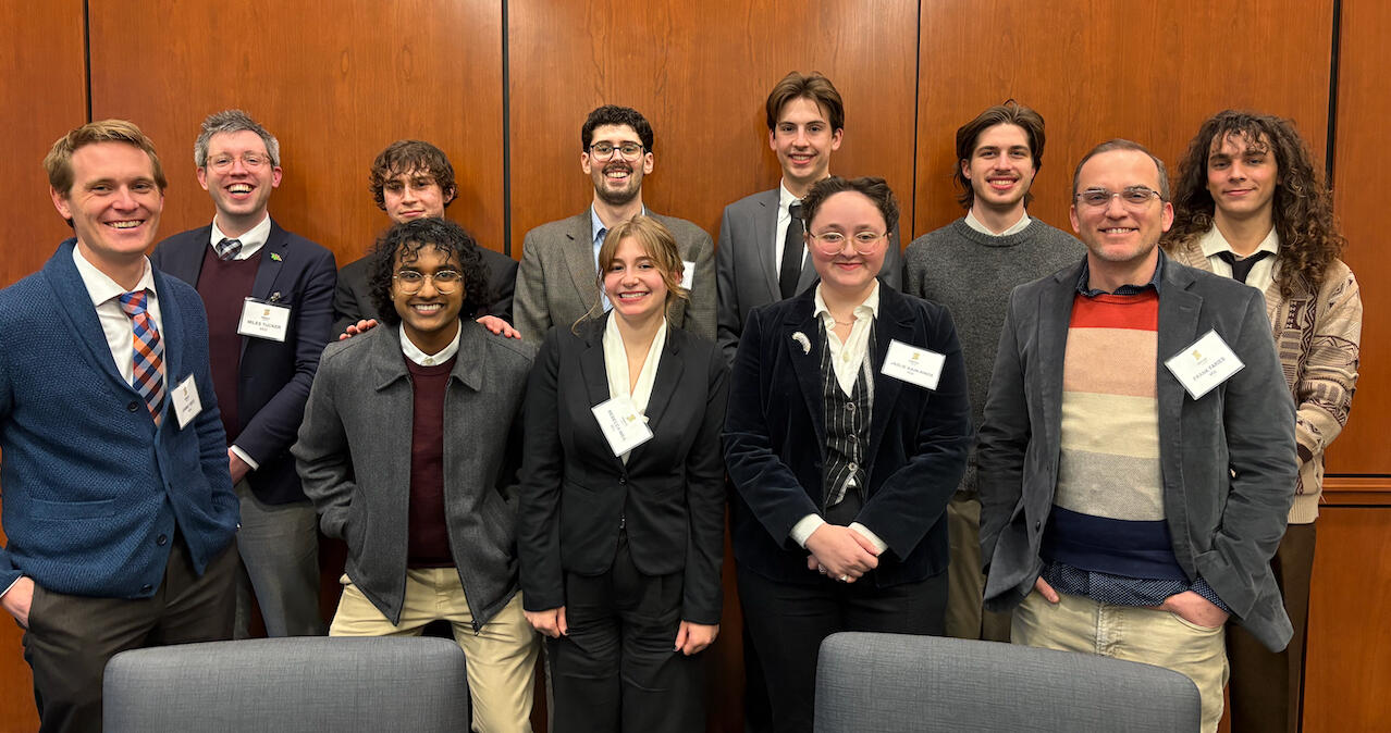 A group photo of 11 people. 