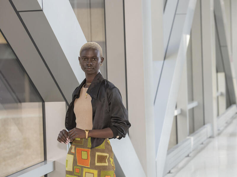 A woman standing in a hallway 