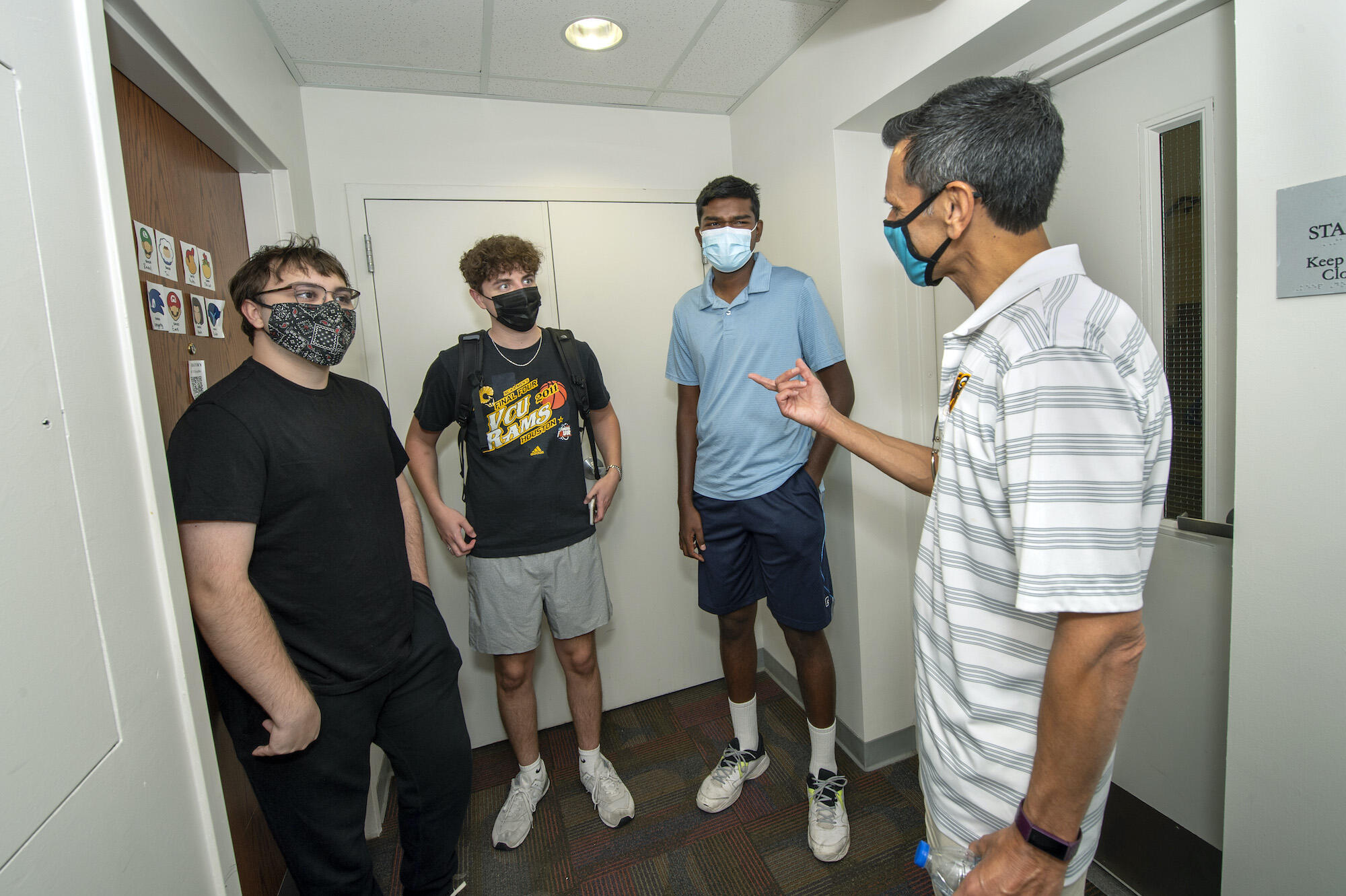 From left to right: Emre Smith, Noah Muldoon and Athithya Muthukrishnan with Rao inside Brandt Hall.
