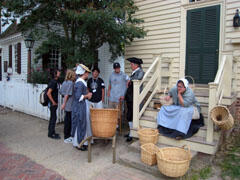East meets West:  Visiting students from Fudan University and Beijing University interact with costumed history interpreters during a trip to Colonial Williamsburg.  Photo courtesy of Jiang Yingying.
