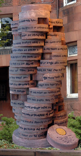 “Tableith” by Charles Ponticello consists of 51 cast discs stacked atop each other and spiraling upward. Each disc represents a year in RPI’s life and is inscribed on its edge with significant phrases from the corresponding year at RPI. 

