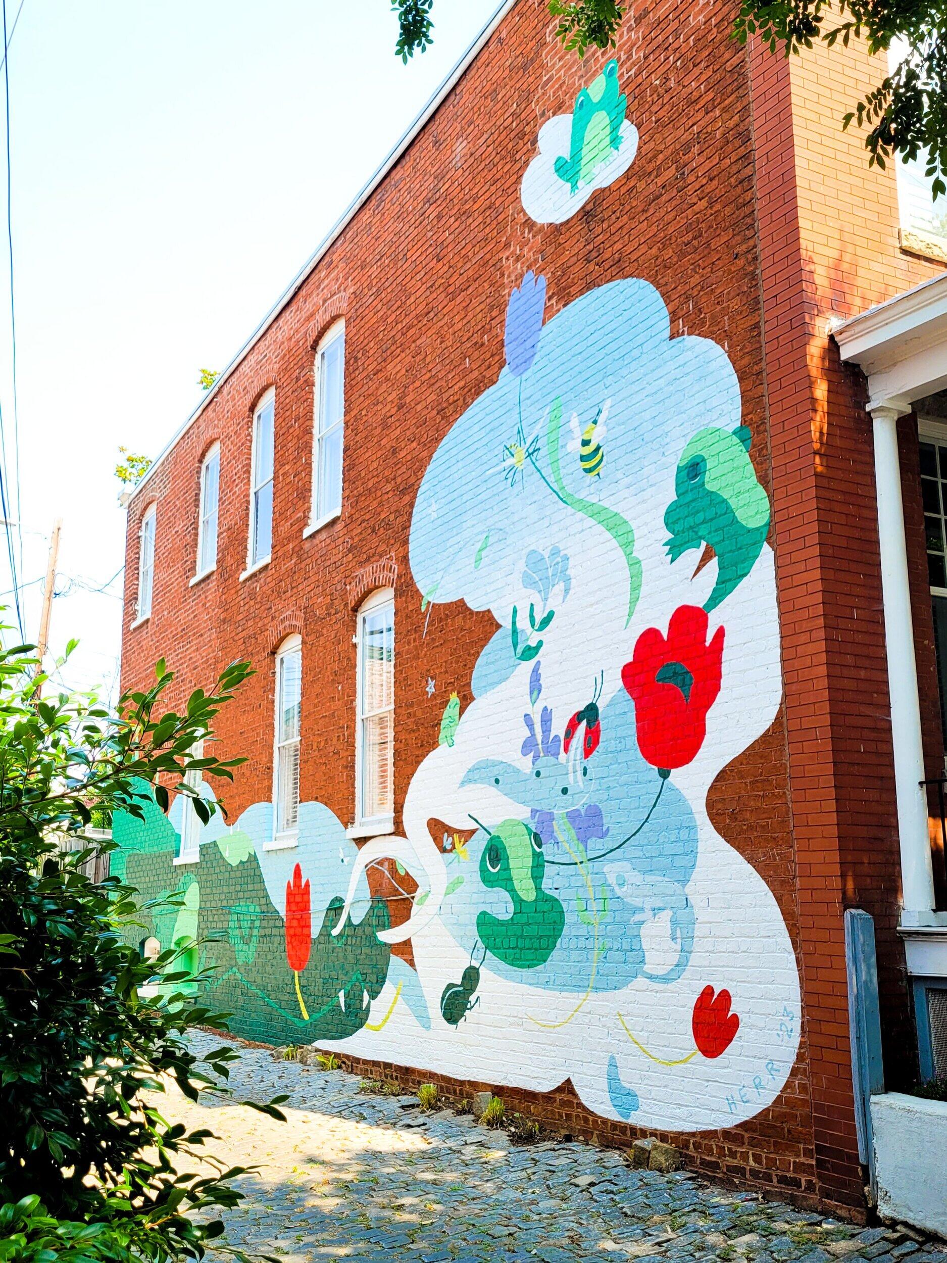 A photo of a mural painted on the side of a building 