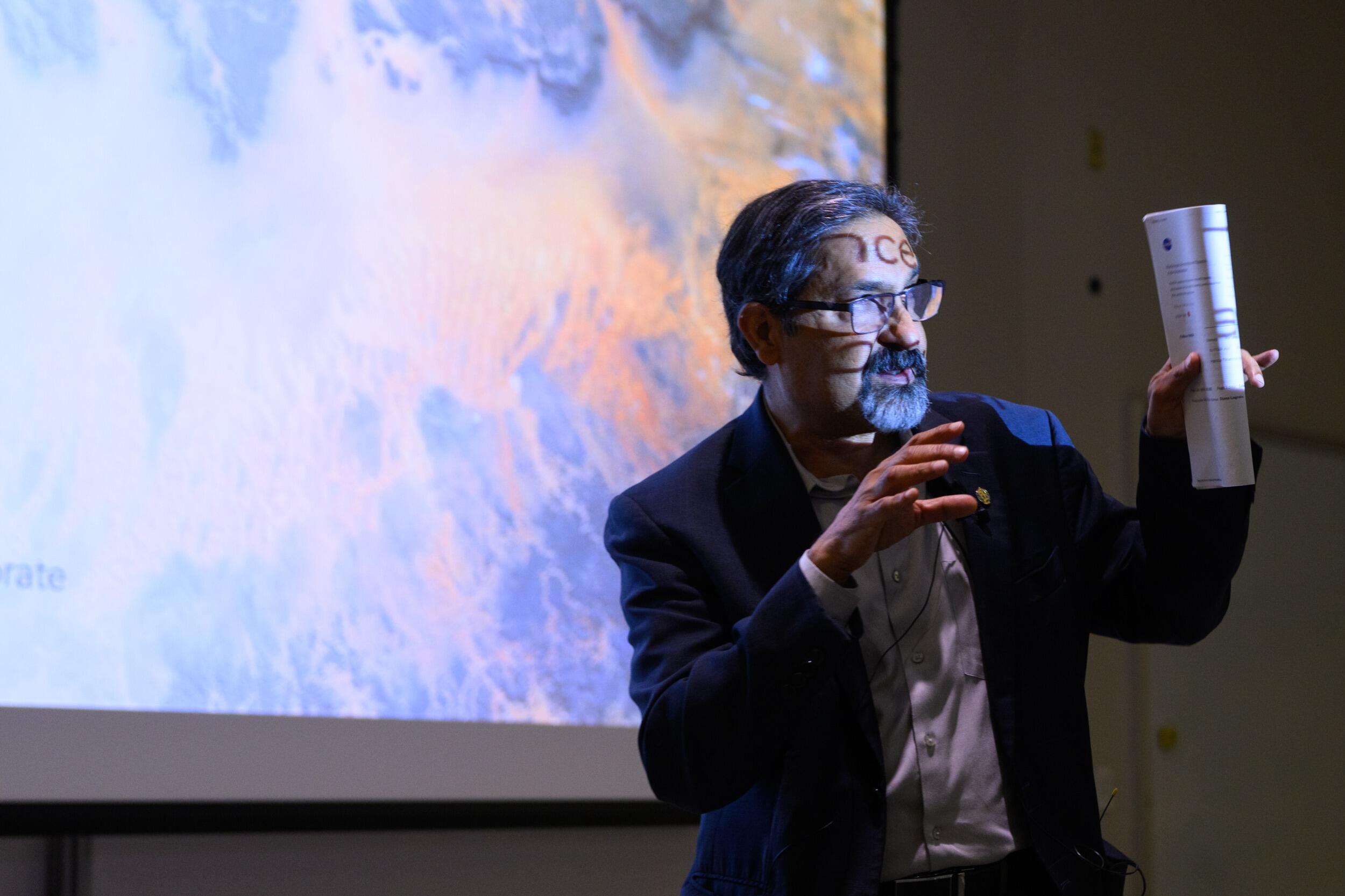 A photo of a man from the waist up. 