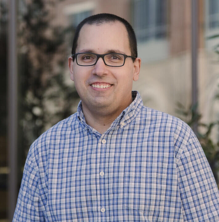 Michael Friedman smiling at the camera.