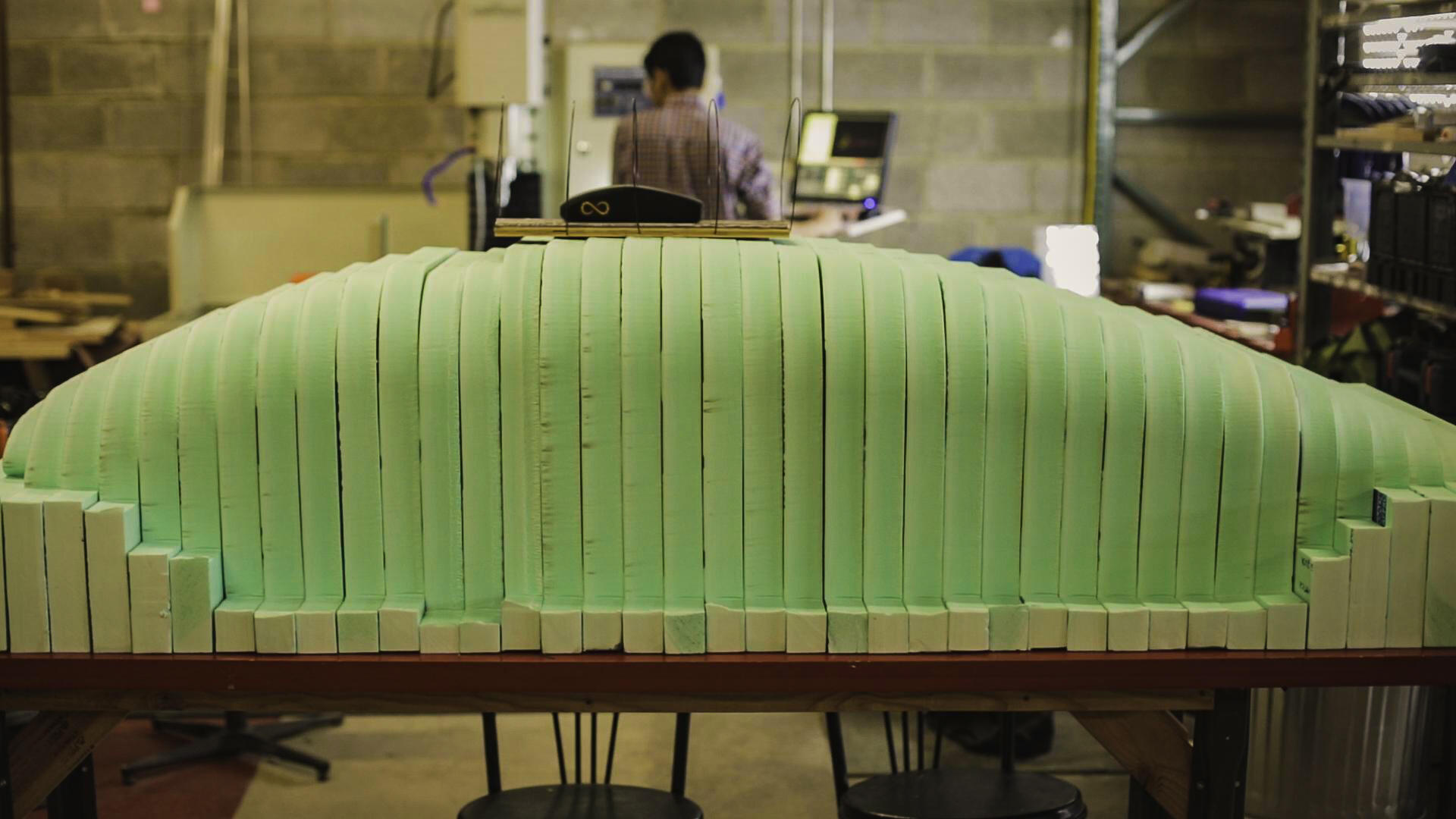The first wooden prototype of the pod's shell design sits atop a full-size foam model used in the shell fabrication. (Photo by Daniel Wagner, VCU College of Engineering)