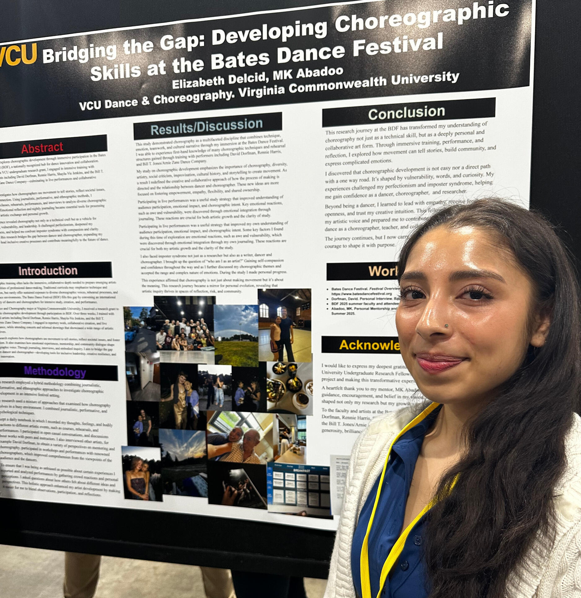 A woman stands in front of a research poster board.