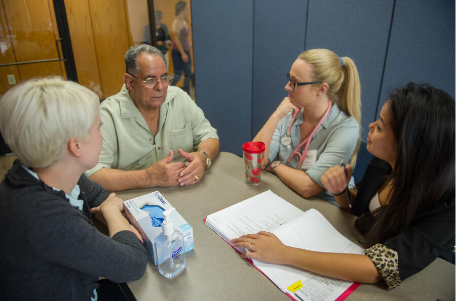 Students from VCU’s health sciences schools consult with a Dominion Place resident as part of the Richmond Health and Wellness Program.
<br>Photo by Allen Jones, VCU University Marketing.